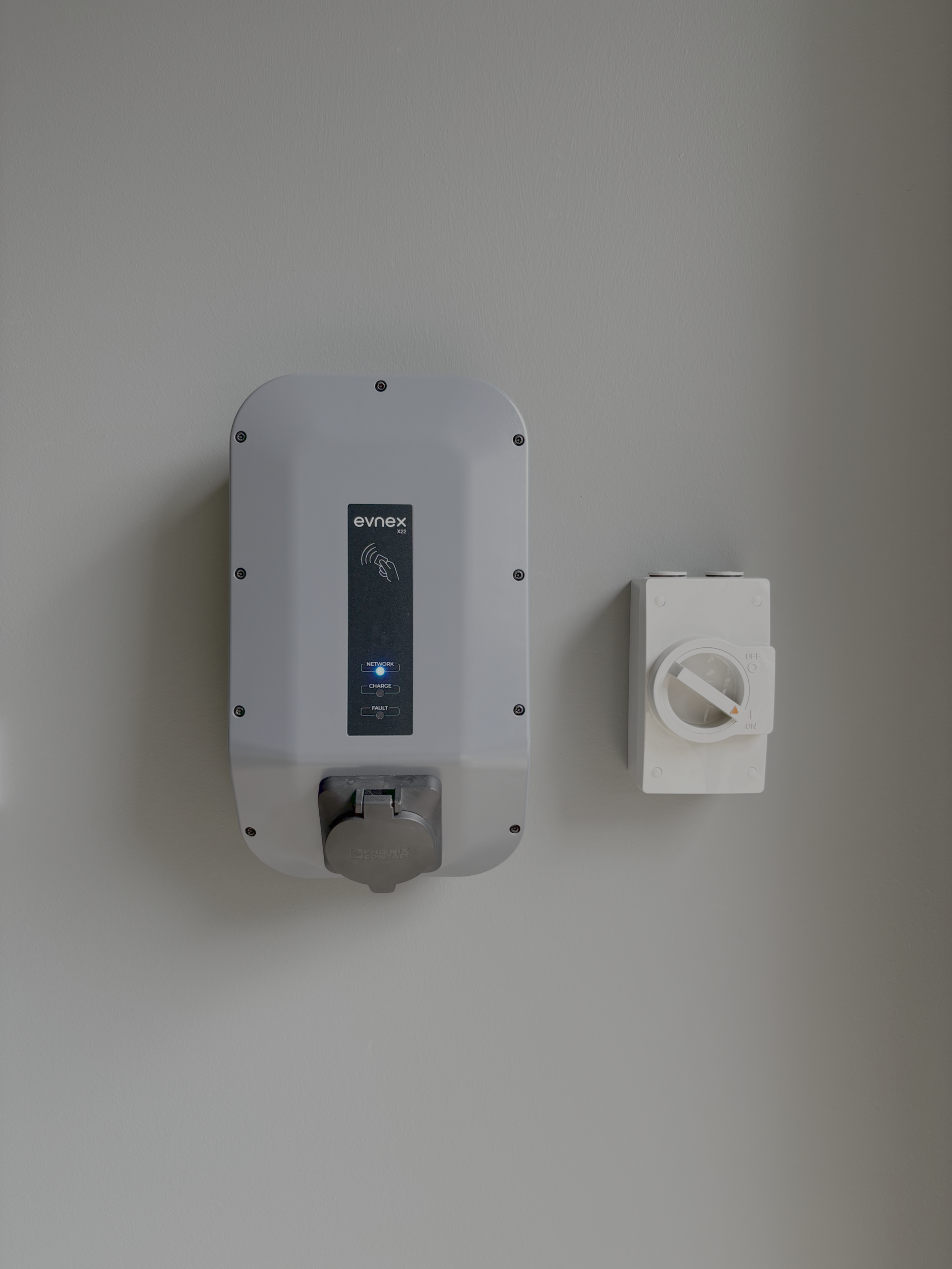 Evnex X22 charger installed on a wall