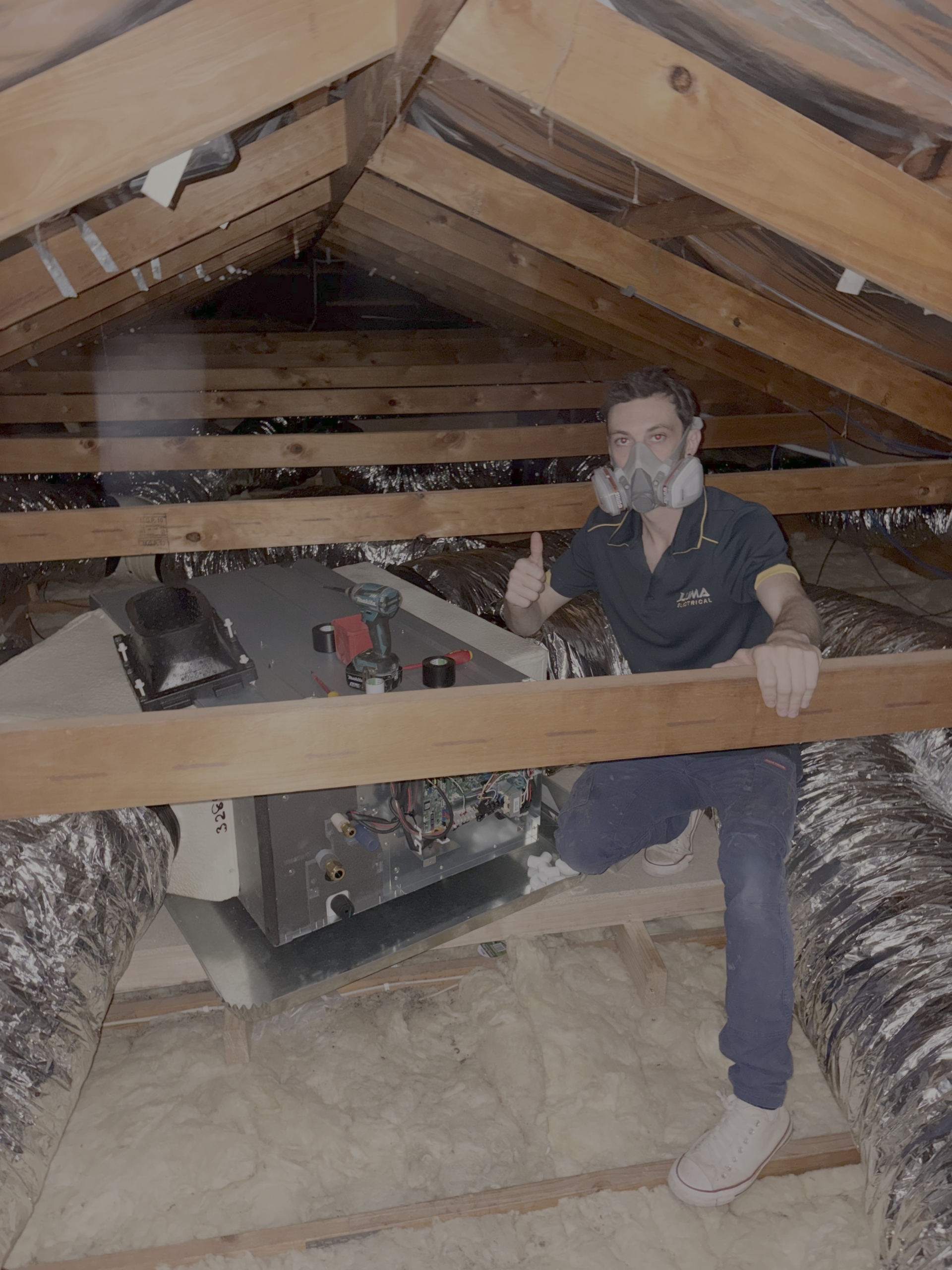 Luma Electrical Employee installing Duct Ac