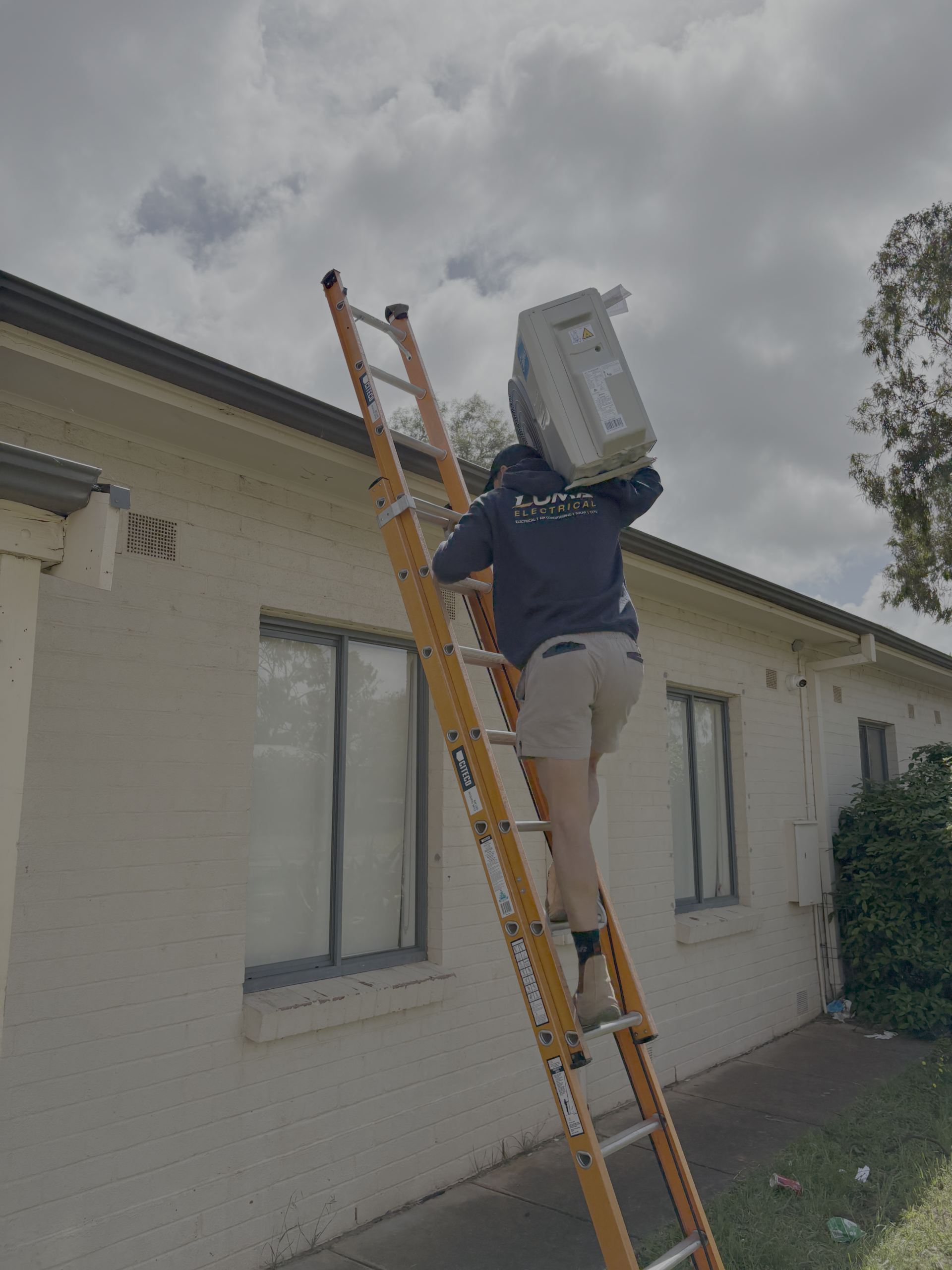 MHI Outdoor unit carried onto a roof