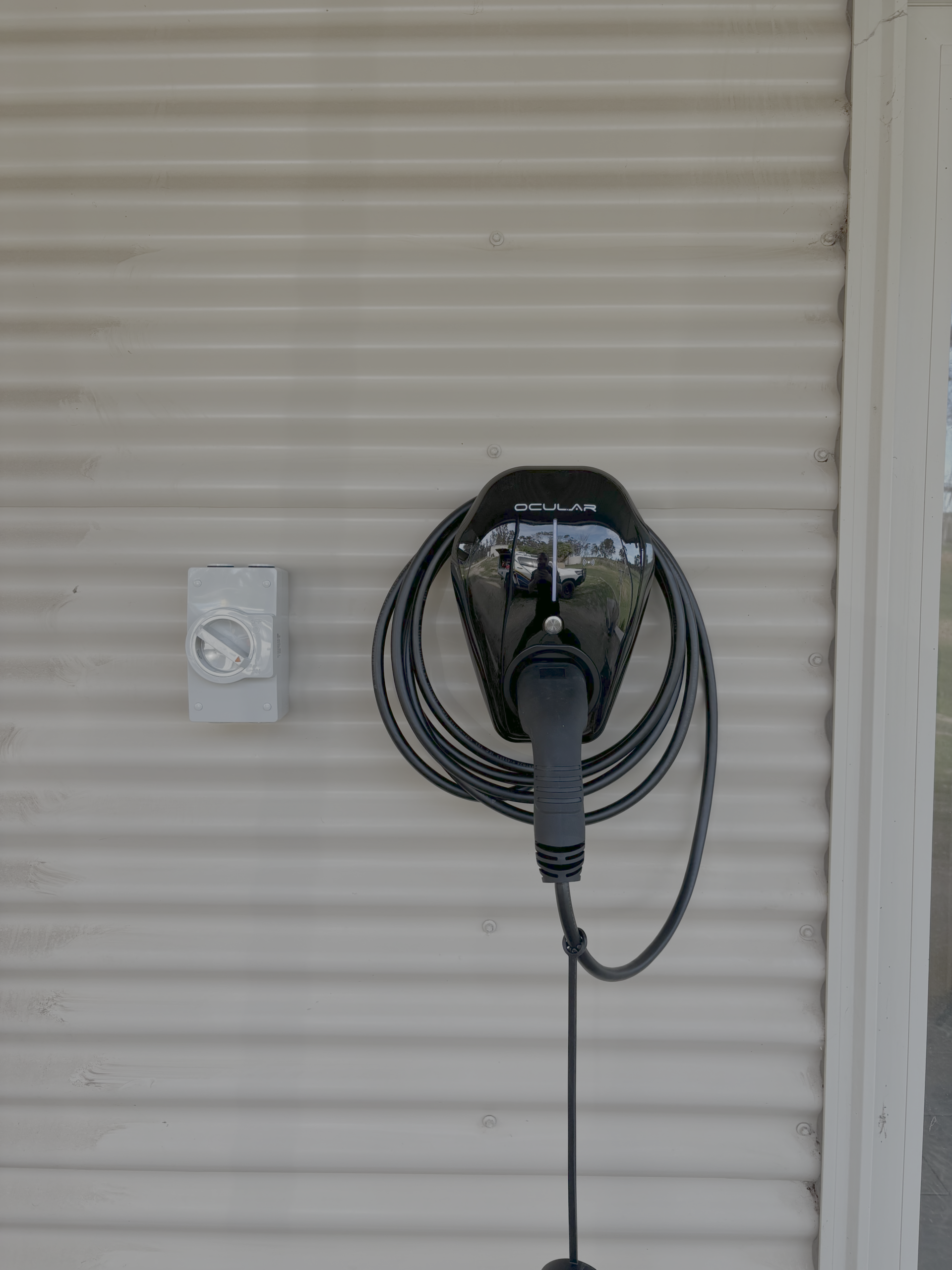 Ocular EV charger install on Corrogate wall